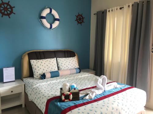 ANCHORAGE INN Moalboalにあるベッド