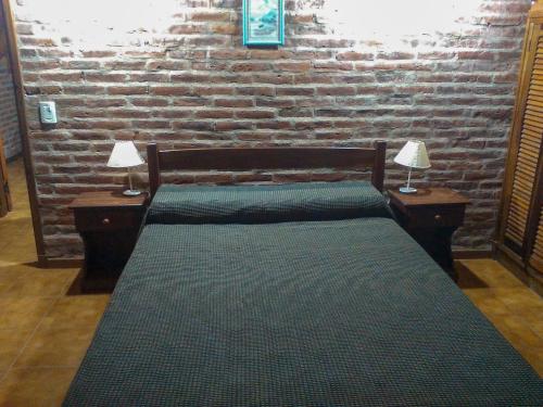 Una cama o camas en una habitación de Cabaña Ostende