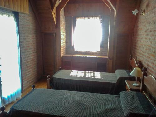 Una cama o camas en una habitación de Cabaña Ostende