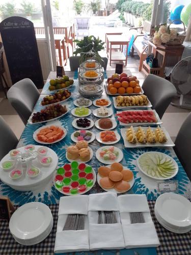 a long table filled with different types of food at BC Summer Beach in Pran Buri