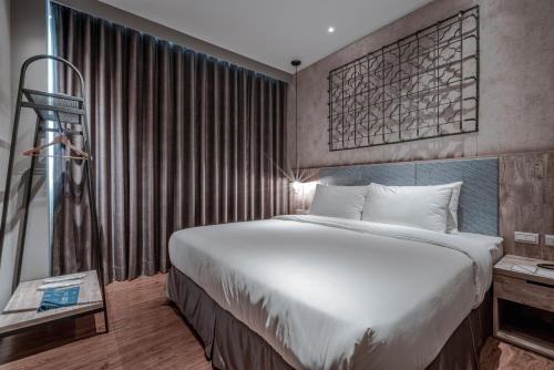Ένα ή περισσότερα κρεβάτια σε δωμάτιο στο Somer Chew Hotel