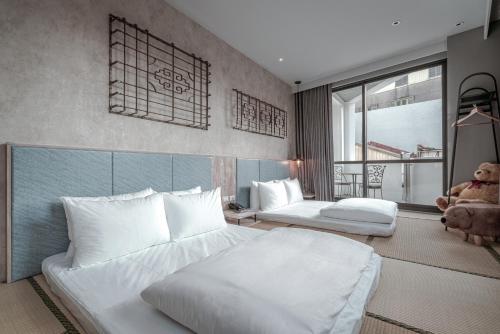Katil atau katil-katil dalam bilik di Somer Chew Hotel