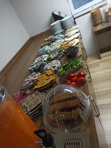 a table filled with different types of food at Hotel Kervansaray in Erzurum