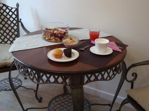 a wooden table with food and drinks on it at B&B Leopoldo in Florence