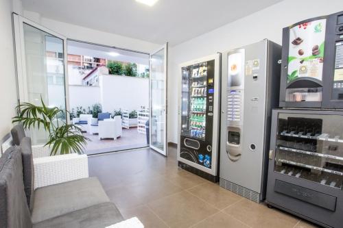 a coffee shop with a drink vending machine at Spuma di mare in Gallipoli