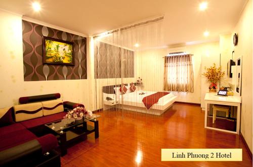 a living room with a couch and a table at Linh Phuong 2 Hotel in Can Tho