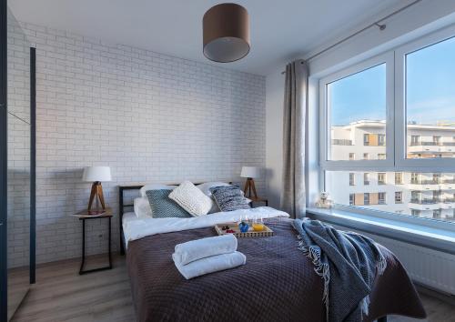 Posteľ alebo postele v izbe v ubytovaní P&O Serviced Apartments Group Komputerowa