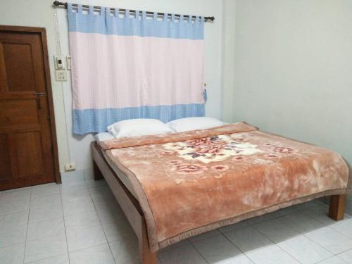 Cama o camas de una habitación en ปฎิภาณบ้านพัก