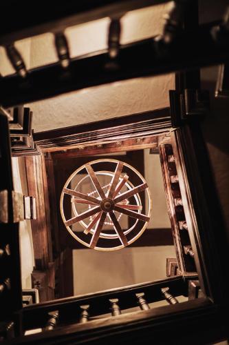 an overhead view of a wooden wheel in a mirror at Great Fosters - Near Windsor in Egham
