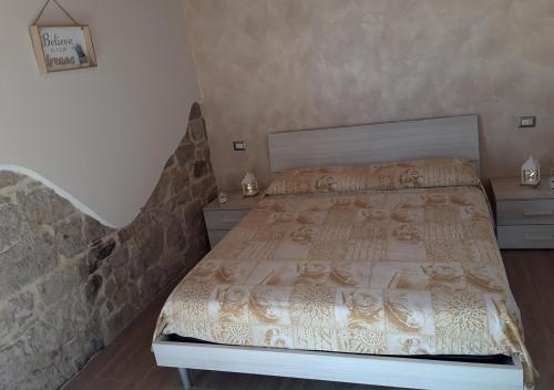 Postel nebo postele na pokoji v ubytování B&B GLI ULIVI
