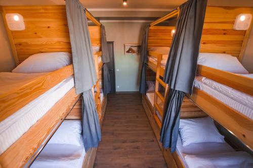 two bunk beds in a room with at DREAM Hostel Khmelnytskyi in Khmelʼnytsʼkyy