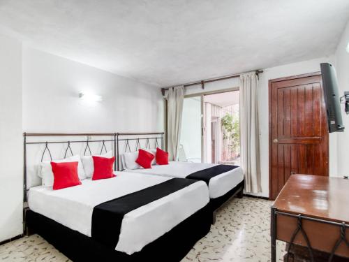 Postel nebo postele na pokoji v ubytování Hotel San Carlos
