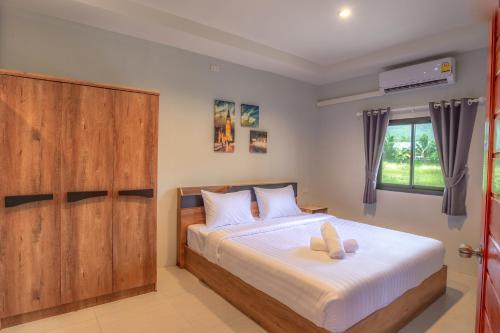 Postel nebo postele na pokoji v ubytování Malinee Resort