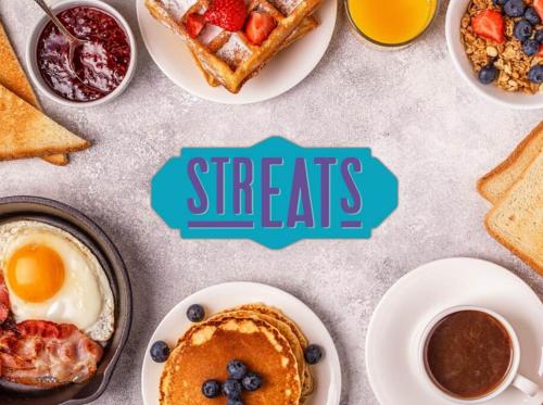 a table with plates of breakfast foods and coffee at Ibis Styles Kuala Lumpur Fraser Business Park in Kuala Lumpur