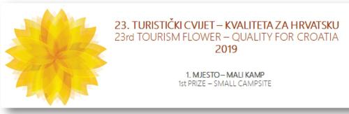 a poster with a yellow flower on a white background at Lavanda Mobile Homes & Villas in Orebić