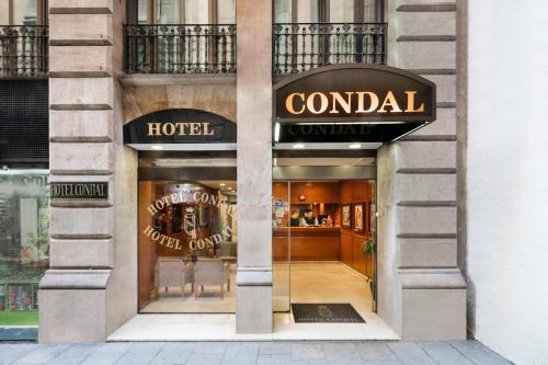 a store front of a hotel with a sign on it at Hotel Condal in Barcelona