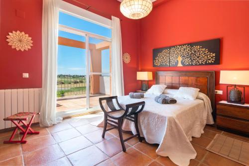 Un pat sau paturi într-o cameră la Villa Golf Sanlucar