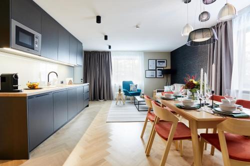 a kitchen and dining room with a table and chairs at das Valdo in Seefeld in Tirol