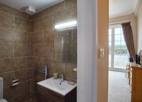 a bathroom with a sink and a shower at The Spa Hotel in Saltburn-by-the-Sea