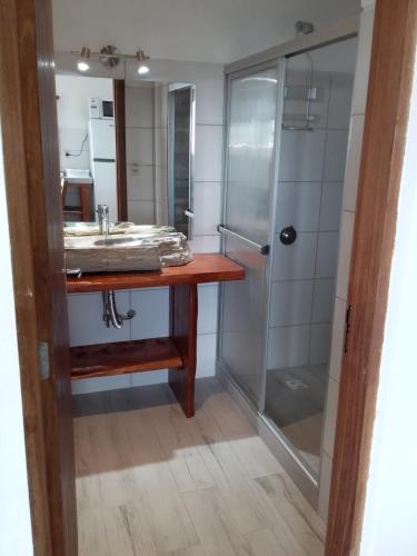 a bathroom with a sink and a shower at Deja Vu 2 in Punta Del Diablo