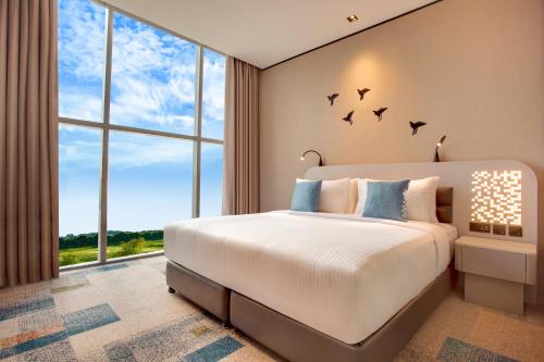Ένα ή περισσότερα κρεβάτια σε δωμάτιο στο Lemon Tree Hotel, Jumeirah Dubai