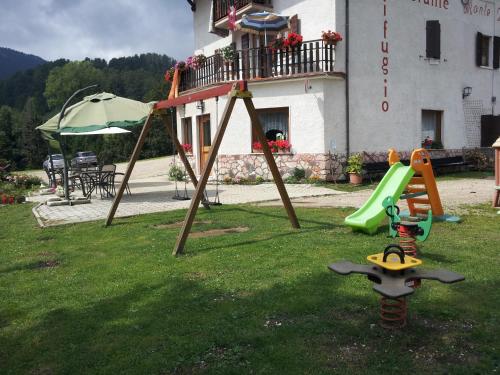 a playground in the yard of a house at Rifugio Monte Baldo in Avio