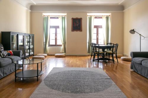 a living room with a couch and a table at Samostan Mekinje in Kamnik