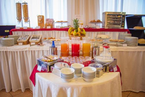 a table with a buffet of food and drinks at Best Western Hotel La Conchiglia in Palinuro