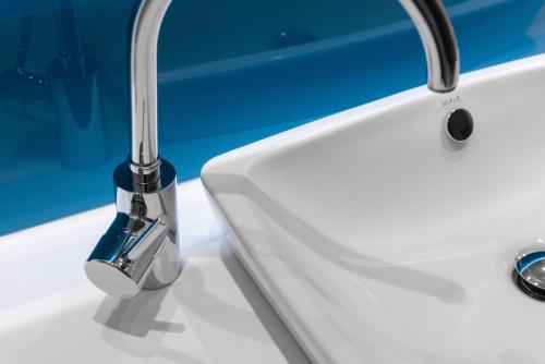 a white sink with a faucet on a counter at Holiday Inn Express - Rouen Centre - Rive Gauche by IHG in Rouen