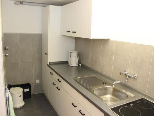 a kitchen with a sink and a counter top at Ferienwohnung Aschoff in Bühl