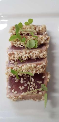 a stack of food with seeds and plants on it at Hotel Les Mésanges in Saint-Martin-dʼUriage