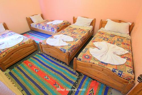 Postel nebo postele na pokoji v ubytování Hotel Aremd - Aroumd Imlil route du Toubkal