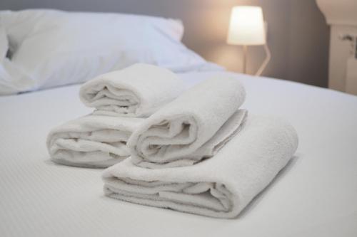 Кровать или кровати в номере PrimoPiano - Piero della Francesca