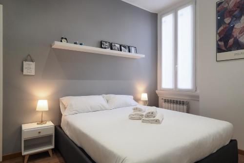 Кровать или кровати в номере PrimoPiano - Piero della Francesca