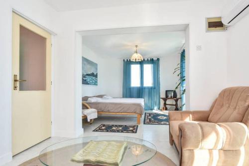 a living room with a couch and a bed at Villa Lana in Crivac