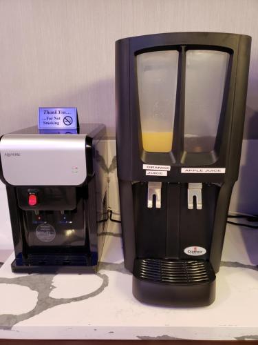 a coffee maker and a blender on a counter at Hotel Blue - Woodlands in Spring