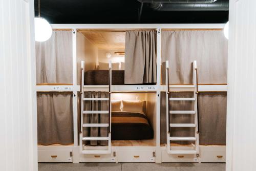 a bunk bed with two bunk beds in a room at Cache House in Jackson