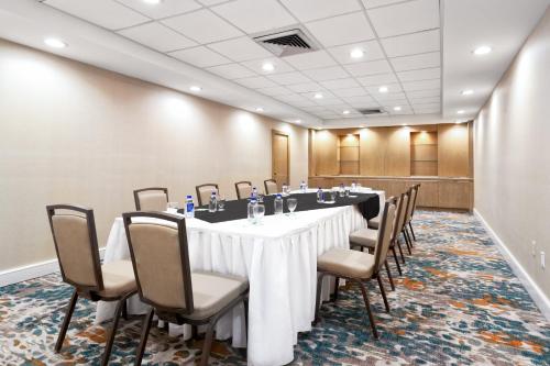 a conference room with a long table and chairs at Holiday Inn Miami West - Airport Area by IHG in Hialeah Gardens