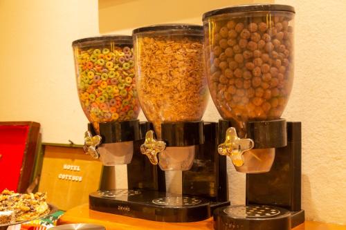 a group of three food processors filled with food at Hotel Cottbus in San Carlos de Bariloche