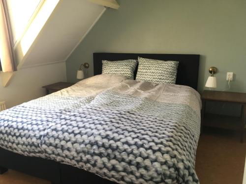 Ліжко або ліжка в номері Warmoes tuinderswoning
