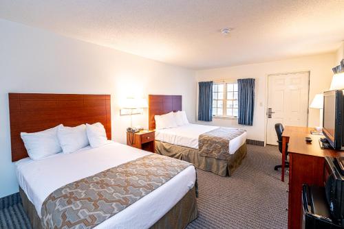 Letto o letti in una camera di Anchorage Motel Inc.