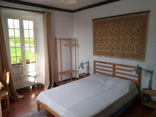 מיטה או מיטות בחדר ב-Casa da Lomba do Cavaleiro