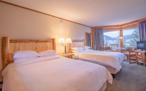 מיטה או מיטות בחדר ב-Discovery Lodge