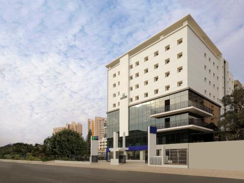 a rendering of a white building at Holiday Inn Express Bengaluru Yeshwantpur, an IHG Hotel in Bangalore