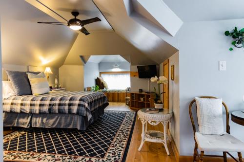 a bedroom with a bed and a ceiling fan at A Hidden Gem Bed and Breakfast in Windsor