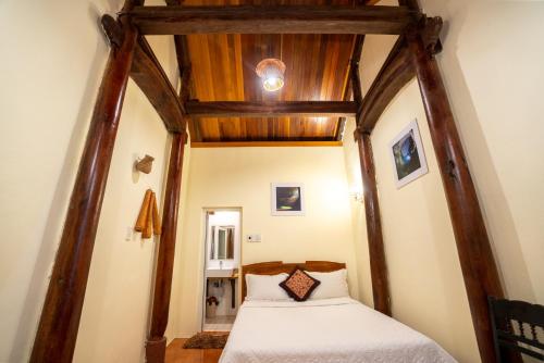 Postel nebo postele na pokoji v ubytování Phong Nha Coco House