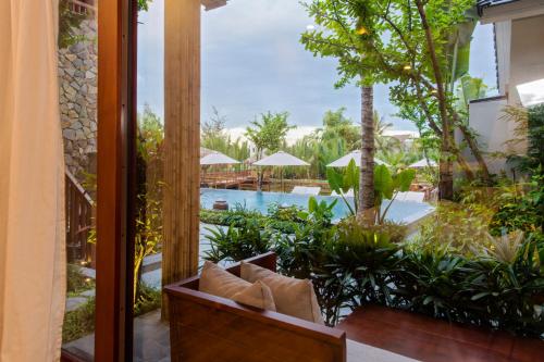 a view of the pool from the balcony of a resort at Hoi An Eco Lodge & Spa in Hoi An