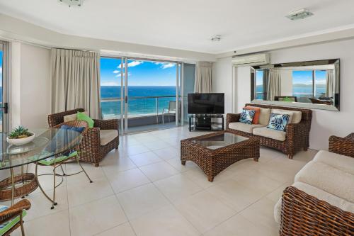 a living room with a view of the ocean at Points North Apartments in Gold Coast