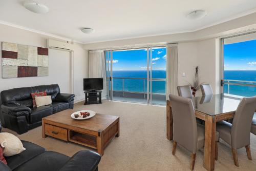a living room with a view of the ocean at Points North Apartments in Gold Coast