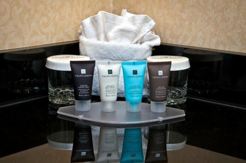 a group of fourental products on a shelf in a bathroom at Crowne Plaza Hotel Portland-Downtown Convention Center by IHG in Portland